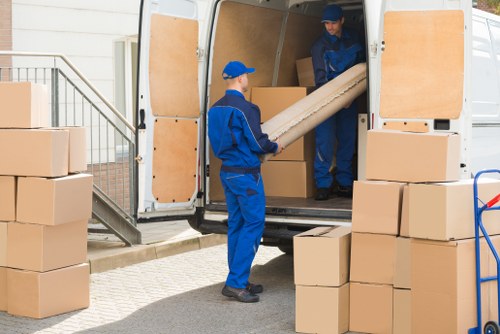 Employees following health and safety practices inside a storage facility