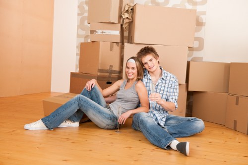 Customer placing items into a storage unit at Raynerslane Storage